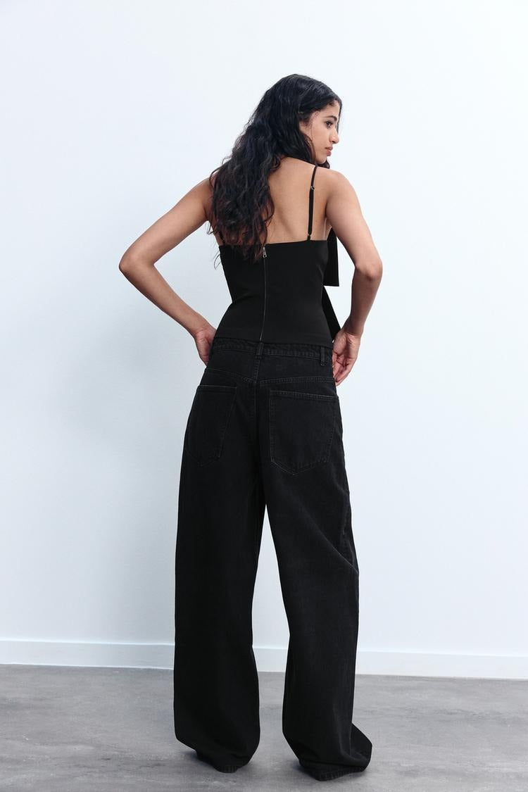 Liora – Sprankelende cropped top met strikdetail