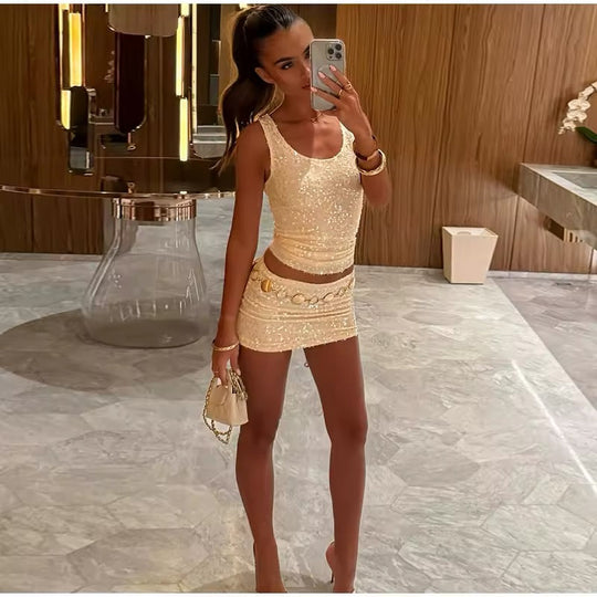 Solennea – Gouden two-piece set met subtiele shimmer